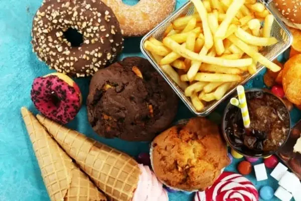 Processed junk foods and sugary snacks—dietary triggers that can worsen acne