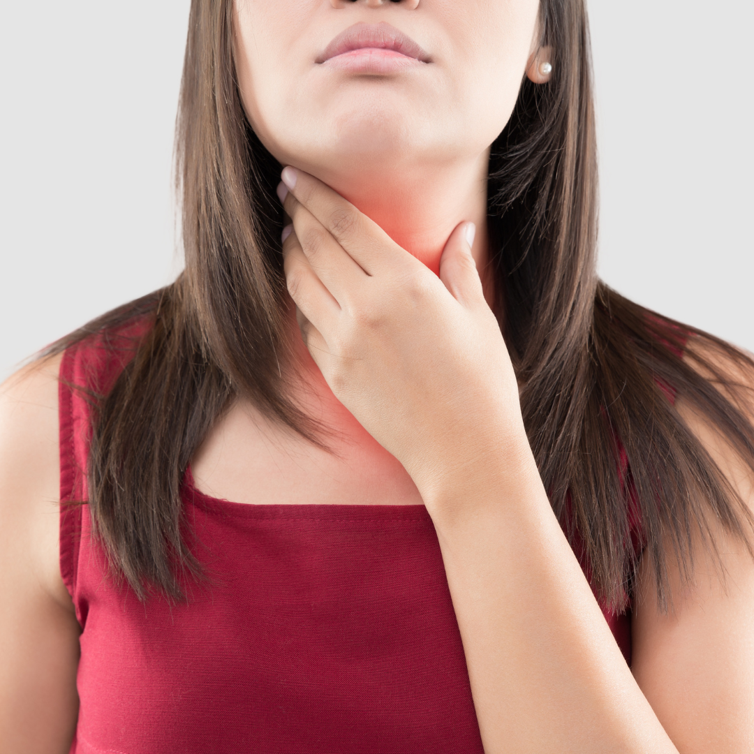 Person experiencing throat irritation caused by acid reflux
