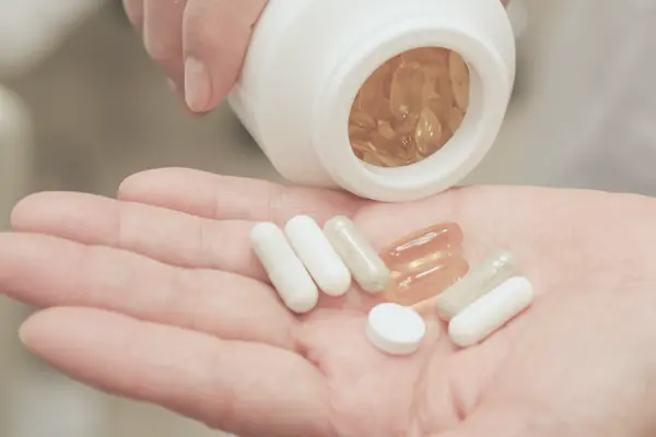 Weight loss supplements in hand—safety and side effects matter